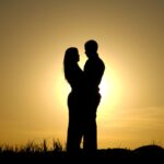 Couple in the sunset: being in love