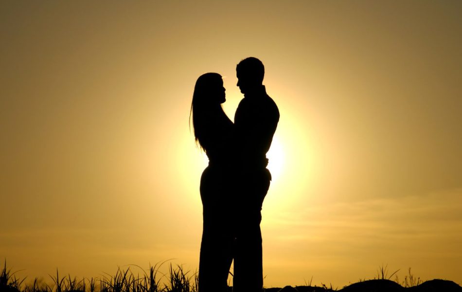 Couple in the sunset: being in love